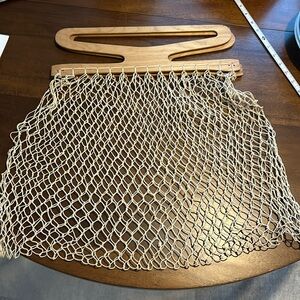 Vintage knotted net fishnet market bag, tote bag, shopping bag with wood handle.